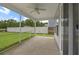 A screened porch that overlooks a backyard and a white fence at 158 Netherfield Dr, Summerville, SC 29486