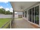 This screened porch offers a ceiling fan and sliding doors with backyard view at 158 Netherfield Dr, Summerville, SC 29486