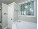 Bathroom featuring soaking tub, tile floors, and a window at 1629 Jorrington Street St, Mount Pleasant, SC 29466