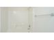 Bright bathroom featuring a tiled tub and shower with white walls and a chrome shower head at 1629 Jorrington Street St, Mount Pleasant, SC 29466