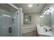 Bathroom with a double sink vanity, soaking tub, and glass enclosed shower at 1629 Jorrington Street St, Mount Pleasant, SC 29466