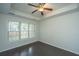 Cozy bedroom with natural light, hardwood floors, and a ceiling fan at 1629 Jorrington Street St, Mount Pleasant, SC 29466