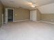 Large bedroom with light tan walls and carpet, closet, and bright windows at 1629 Jorrington Street St, Mount Pleasant, SC 29466