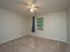 Bedroom with neutral walls and carpet, plus a window with blinds and a curtain at 1629 Jorrington Street St, Mount Pleasant, SC 29466