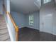 Inviting entryway features hardwood floors, a staircase with carpeted steps, and a view into an adjacent room at 1629 Jorrington Street St, Mount Pleasant, SC 29466
