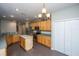 Well-lit kitchen featuring stainless steel appliances, an island, and hardwood floors at 1629 Jorrington Street St, Mount Pleasant, SC 29466