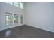 Bright living room with hardwood floors, large windows, and high ceilings at 1629 Jorrington Street St, Mount Pleasant, SC 29466