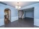 Open-concept living space showcases hardwood floors, elegant wainscoting, and a staircase, offering seamless flow and connectivity at 1629 Jorrington Street St, Mount Pleasant, SC 29466