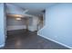 Spacious living room featuring hardwood floors, elegant wainscoting, a chandelier, and natural light at 1629 Jorrington Street St, Mount Pleasant, SC 29466