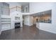Spacious living room featuring hardwood floors, a fireplace, and an open floor plan with kitchen view at 1629 Jorrington Street St, Mount Pleasant, SC 29466