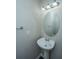 Powder room featuring a pedestal sink and oval mirror at 1629 Jorrington Street St, Mount Pleasant, SC 29466
