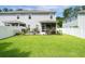 Expansive green backyard featuring privacy fence, patio and mature landscaping at 1630 Mermentau St, Mount Pleasant, SC 29466