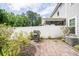 Backyard patio space with brick pavers, a grill, and manicured landscaping at 1630 Mermentau St, Mount Pleasant, SC 29466