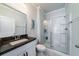 Clean bathroom with a granite vanity, glass-enclosed shower, and modern fixtures, offering a stylish and functional space at 1630 Mermentau St, Mount Pleasant, SC 29466