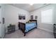 Cozy bedroom with a full-sized bed, ceiling fan and large window, ideal for a room at 1630 Mermentau St, Mount Pleasant, SC 29466