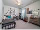 Inviting bedroom features a full-sized bed, a ceiling fan and lots of natural light at 1630 Mermentau St, Mount Pleasant, SC 29466