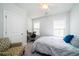 Bright bedroom with a ceiling fan, natural light, and a cozy chair, creating a comfortable and inviting atmosphere at 1630 Mermentau St, Mount Pleasant, SC 29466