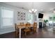 Inviting dining area features a rustic table, fireplace, and ample natural light at 1630 Mermentau St, Mount Pleasant, SC 29466