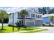 Attractive home boasts lush green lawn, palm trees, attached garage, and inviting curb appeal at 1630 Mermentau St, Mount Pleasant, SC 29466