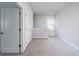 Bright hallway featuring neutral carpet and white walls, offering a clean and open transition between rooms at 1630 Mermentau St, Mount Pleasant, SC 29466