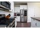Bright kitchen features granite counters, stainless appliances, white cabinets and access to a dining area at 1630 Mermentau St, Mount Pleasant, SC 29466