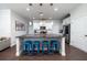 Stylish kitchen boasts granite countertops, stainless steel appliances, and a center island with bar seating at 1630 Mermentau St, Mount Pleasant, SC 29466