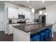Modern kitchen features granite counters, stainless appliances, white cabinets, and a spacious layout at 1630 Mermentau St, Mount Pleasant, SC 29466
