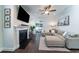 Bright living room featuring a cozy fireplace, large sectional sofa, and sliding glass doors to a backyard area at 1630 Mermentau St, Mount Pleasant, SC 29466