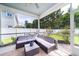 Relaxing screened porch with ceiling fan, patio seating, and backyard view at 1630 Mermentau St, Mount Pleasant, SC 29466