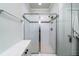 This tiled shower features glass doors, built in shower caddy and sleek chrome fixtures at 1630 Mermentau St, Mount Pleasant, SC 29466