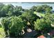 Aerial view of a home nestled among lush trees, showcasing its well-maintained roof and surrounding greenery at 1807 Perch Rd, Moncks Corner, SC 29461