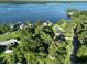 Breathtaking aerial view of waterfront homes nestled among trees, boasting stunning water views and serene surroundings at 1807 Perch Rd, Moncks Corner, SC 29461