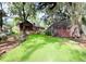 Green backyard view with a brick home on the left at 1807 Perch Rd, Moncks Corner, SC 29461