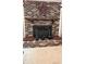 Close-up of a traditional brick fireplace with mantel and decorative accents at 1807 Perch Rd, Moncks Corner, SC 29461