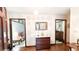 Inviting foyer with hardwood floors, decorative mirror, and views into other rooms at 1807 Perch Rd, Moncks Corner, SC 29461