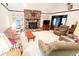 Cozy living room featuring a brick fireplace and ample seating for Gathering and friends at 1807 Perch Rd, Moncks Corner, SC 29461