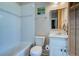Bright bathroom featuring a white tiled shower and a modern vanity with marble countertop at 1872 Staffwood Rd, Johns Island, SC 29455