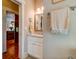 Hall bathroom featuring a vanity and a view of the kitchen at 1872 Staffwood Rd, Johns Island, SC 29455