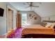 Bedroom features a window with slatted shades, a ceiling fan, and hardwood floors at 1872 Staffwood Rd, Johns Island, SC 29455