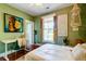 Comfortable bedroom featuring a work desk, natural light, hardwood floors and stylish decor at 1872 Staffwood Rd, Johns Island, SC 29455