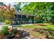 Charming home with a lush front yard, stone pathway, and mature trees at 1872 Staffwood Rd, Johns Island, SC 29455