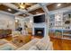 Comfortable living room with fireplace, hardwood floors, custom built-ins, and a cozy seating arrangement at 1872 Staffwood Rd, Johns Island, SC 29455