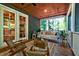 Relaxing screened porch with porch swing and comfortable seating at 1872 Staffwood Rd, Johns Island, SC 29455