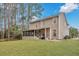 Large, green backyard with a charming two-story house featuring a screened in porch at 2004 Hammond Dr, Mount Pleasant, SC 29466