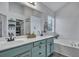 Bright bathroom with double sinks, a soaking tub, and stylish finishes, offering a spa-like experience at 2004 Hammond Dr, Mount Pleasant, SC 29466