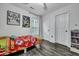 Bedroom with a themed bedspread, hardwood floors, standard doors, and athletic memorabilia at 2004 Hammond Dr, Mount Pleasant, SC 29466