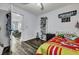 Bedroom featuring hardwood floors, toys, a ceiling fan, and adjacent room with seating at 2004 Hammond Dr, Mount Pleasant, SC 29466