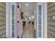 Inviting entryway featuring a stylish pink front door that leads into a modern, open-concept home at 2004 Hammond Dr, Mount Pleasant, SC 29466