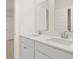 Bright bathroom featuring white double vanity, a large mirror, and modern fixtures at 205 Bilge Rd, Ridgeville, SC 29472
