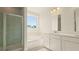 Primary bathroom features a walk-in shower, soaking tub, double sinks, and a large mirror at 205 Bilge Rd, Ridgeville, SC 29472